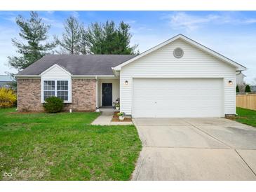 Charming single-Gathering home featuring a two-car garage and well-manicured lawn at 4619 Churchill Downs Cir, Greenwood, IN 46143