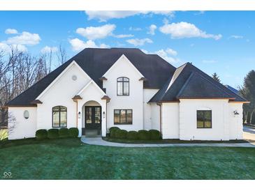 Stunning two-story home with a white brick facade and manicured lawn at 2071 Eagle Trace Dr, Greenwood, IN 46143