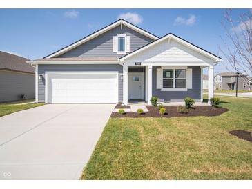 Charming home featuring a well-maintained lawn, gray siding, and a spacious two-car garage at 5146 Cartland Dr, Indianapolis, IN 46239
