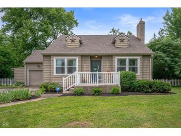 Charming home featuring a well-manicured lawn, neutral siding, and inviting front porch at 6865 Meadow View Dr, Lawrence, IN 46226