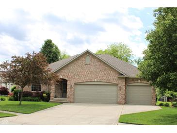 Charming single story brick home with an attached two car garage and beautifully maintained lawn at 11 Stratford Way, Danville, IN 46122