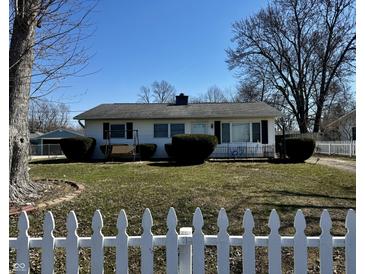 Charming ranch-style home with a well-maintained lawn, mature landscaping, and a classic white picket fence at 143 Sawmill Rd, Whiteland, IN 46184