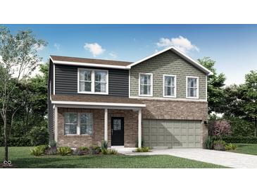 Charming two-story home featuring a brick facade, a covered front porch and an attached two-car garage at 4046 Jacoby Pl, Indianapolis, IN 46268