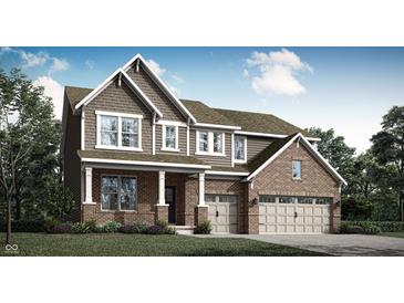 Beautiful two-story home featuring a brick and shingle exterior, attached two-car garage, and manicured landscaping at 11542 Aubrey Ln, Fishers, IN 46040
