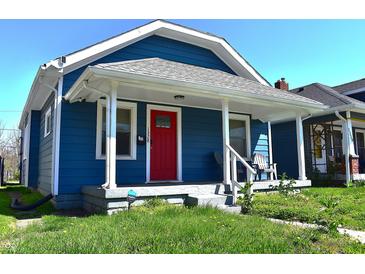 Charming blue home with a vibrant red front door and a welcoming covered porch at 1328 E Minnesota St, Indianapolis, IN 46203