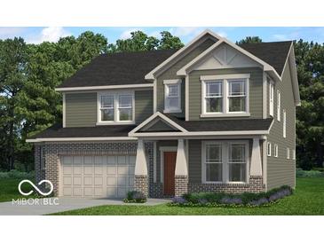 Two-story home with gray siding, brick accents, covered porch, and well-manicured lawn at 449 Hidden Hills Dr, Pittsboro, IN 46167