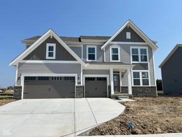 Beautiful two-story home with a three-car garage and stone accents at 640 Firefly Ct, Greenfield, IN 46140