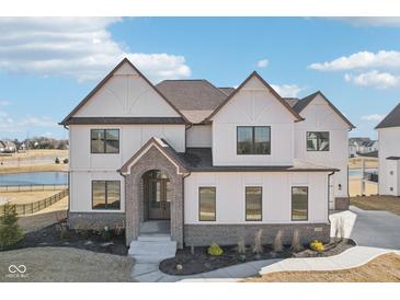 Stunning two-story home with a beautiful brick entryway and professionally landscaped yard at 15969 Sonnet Park Ln, Westfield, IN 46074