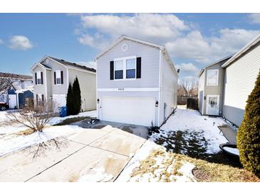Charming home featuring a two-car garage and landscaped front yard at 4438 Fullwood Ct, Indianapolis, IN 46254