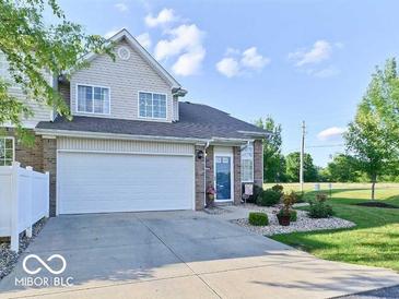 Charming two-story home with a two car garage, brick facade and a well-maintained lawn at 5944 Streamwood Ln, Indianapolis, IN 46237