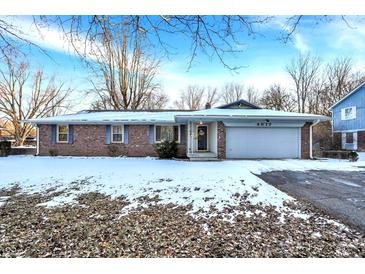 Charming brick ranch with a well-maintained lawn and a large driveway, perfect for suburban living at 4017 W Fairview Rd, Greenwood, IN 46142