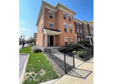 Attractive brick two-story home with landscaped yard and inviting entrance showcasing curb appeal at 9506 Oakley Dr, Indianapolis, IN 46260