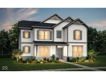 Charming two-story home featuring white siding, gray shutters, and a well-manicured lawn at 14447 Bishop Birch Pl, Carmel, IN 46032