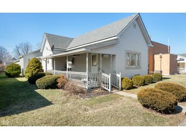 Charming home with a welcoming front porch and well-maintained landscaping at 234 S East St, Pendleton, IN 46064