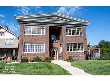 Stunning brick building with classic architecture, large windows, and inviting entrance at 3034 N Pennsylvania St # 1, Indianapolis, IN 46205