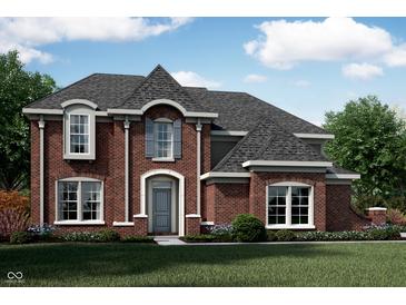 Charming two-story brick home with a well-manicured lawn and a classic architectural design at 6839 Oakdale Ln, Avon, IN 46123