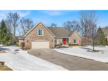 Charming brick home with a two-car garage and a well-manicured lawn in a desirable neighborhood at 8717 Vintner Ct, Indianapolis, IN 46256