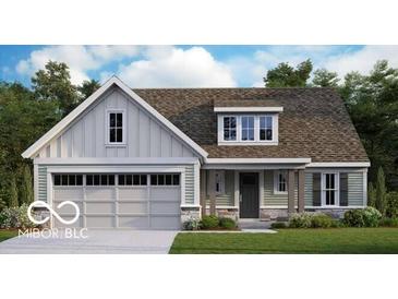 Charming single-Gathering home featuring light siding, stone accents, and an attached two-car garage at 1089 Knoll St, Greenwood, IN 46143