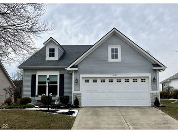 Charming single-Gathering home featuring a well-manicured lawn and a two-car garage with beautiful curb appeal at 12075 Sugar Creek Rd, Noblesville, IN 46060