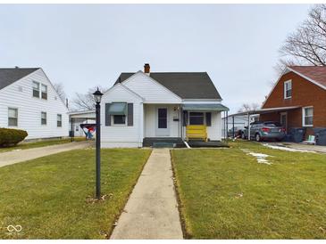 Charming single-story home with well-maintained lawn and covered entry, providing a welcoming curb appeal at 3016 Sheridan St, Anderson, IN 46016