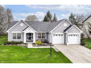 Charming single-story home with a well-maintained lawn and a two-car garage in a suburban neighborhood at 5300 Breakers Way, Carmel, IN 46033