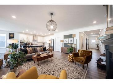 Open living space with modern furnishings and a view of the kitchen at 720 Keck Way, Westfield, IN 46074