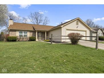 Charming single-story home with a well-manicured lawn and inviting curb appeal at 7579 Allenwood Ct, Indianapolis, IN 46268