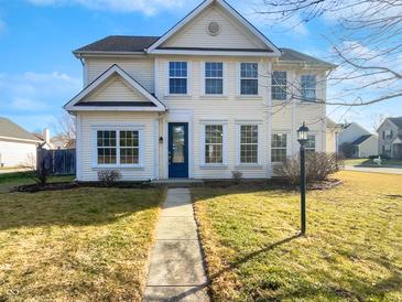 Inviting two-story home featuring a well-maintained lawn and classic architectural details at 1535 Arbor Springs Dr, Brownsburg, IN 46112