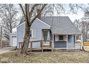 Charming single-Gathering home featuring a quaint front porch and blue siding with white trim at 2420 Sheffield Ave, Anderson, IN 46011