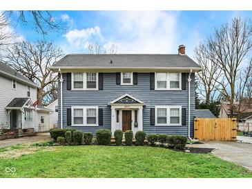 Charming two-story home featuring a well-maintained lawn and classic architectural details at 4517 Central Ave, Indianapolis, IN 46205