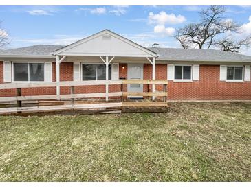 Charming brick ranch home with a welcoming front porch and well-maintained yard at 17 Crestview Dr, Greenwood, IN 46143