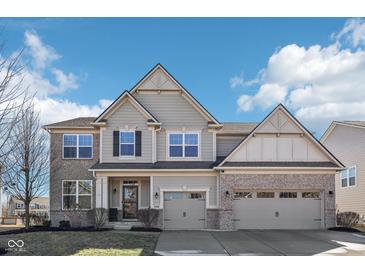 Charming two-story home with a mix of brick and siding exterior, and a well-manicured front yard at 4905 Andover Pkwy, Westfield, IN 46062