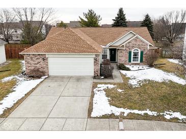 Charming single-Gathering home with a brick facade, attached garage, and well-maintained lawn at 10120 Youngwood Ln, Fishers, IN 46038