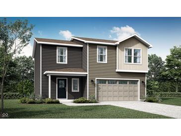 Charming two-story home featuring a covered porch, attached two-car garage and neutral-colored siding at 11735 Vale St, Indianapolis, IN 47235