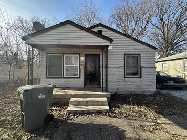 Modest single-story home with a small front porch and landscaping at 3614 N Whittier Pl, Indianapolis, IN 46218