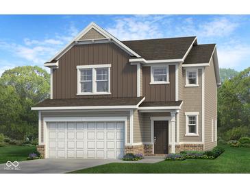 Two-story home with a two-car garage, vertical siding, and a covered front porch at 1951 Black Oak Dr, Shelbyville, IN 46176