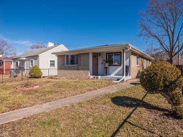 Charming single-story home featuring a textured brick facade and a well-maintained front yard at 2333 Villa Ave, Indianapolis, IN 46203