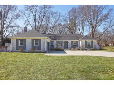 Charming brick ranch-style home with gray shutters and a well-manicured front lawn at 7844 N Audubon Rd, Indianapolis, IN 46250