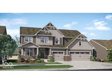 Charming two-story home with gray siding, three-car garage, manicured lawn, and a welcoming front porch at 15372 Hurst Rd, Fishers, IN 46040