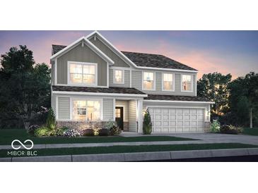 Charming two-story home with gray siding, brick accents, well-maintained landscaping and an attached two-car garage at 17008 Sandhurst Pl, Westfield, IN 46074