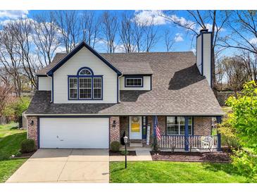 Charming two-story home with a well-maintained lawn, attached garage, and welcoming front porch at 17420 Dalton Ct, Noblesville, IN 46062