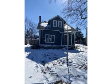 Charming two-story home with classic architectural details during a snowy day at 207 E Broadway St, Alexandria, IN 46001