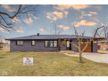 Charming single-story home with stone exterior, updated windows, and attached garage at 2625 15Th St, Columbus, IN 47201