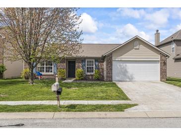 Charming single-Gathering home with brick and siding, a well-manicured lawn, and an attached two-car garage at 4732 Ashfield Dr, Westfield, IN 46062