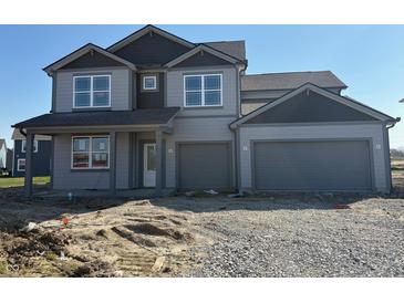 Two story home featuring gray siding, a two car garage, and dark gray accents at 5558 Tart Blvd, Indianapolis, IN 46239