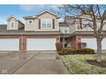 Charming townhome with a two-car garage, brick accents, and inviting curb appeal in a well-kept neighborhood at 5682 Castor Way, Noblesville, IN 46062