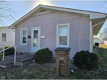 Charming single story home with vinyl siding, an inviting front entrance and manicured landscaping at 428 Cleveland St, Columbus, IN 47201