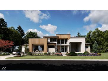 Stunning modern home with light wood accents, lush landscaping, and a manicured lawn at 10440 Somerford Rdg, Zionsville, IN 46077
