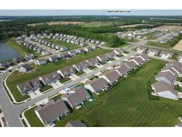 Expansive aerial view of a suburban neighborhood, showcasing well-maintained lawns and the Bear Slide Golf Club in the distance at 50 Hovden Dr, Cicero, IN 46034