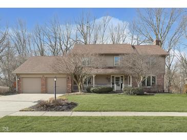 Charming two-story home with a well-maintained front lawn and attached two-car garage at 504 Stony Creek Cir, Noblesville, IN 46060